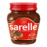 A 350g jar of Sarelle Hazelnut Spread With Cocoa, featuring a red lid and label with a slice of bread topped with rich hazelnut spread and whole hazelnuts.